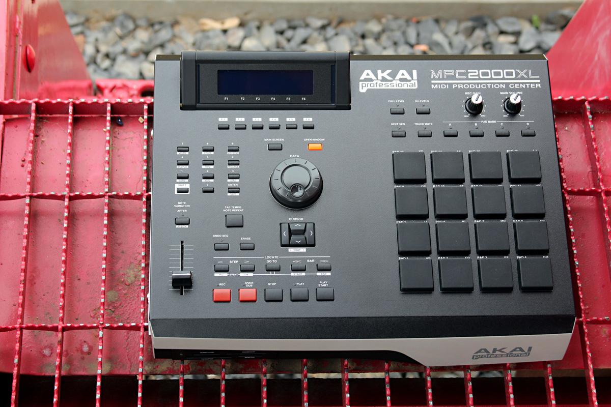Custom white and black face Akia MPC 2000XL on red train grate.