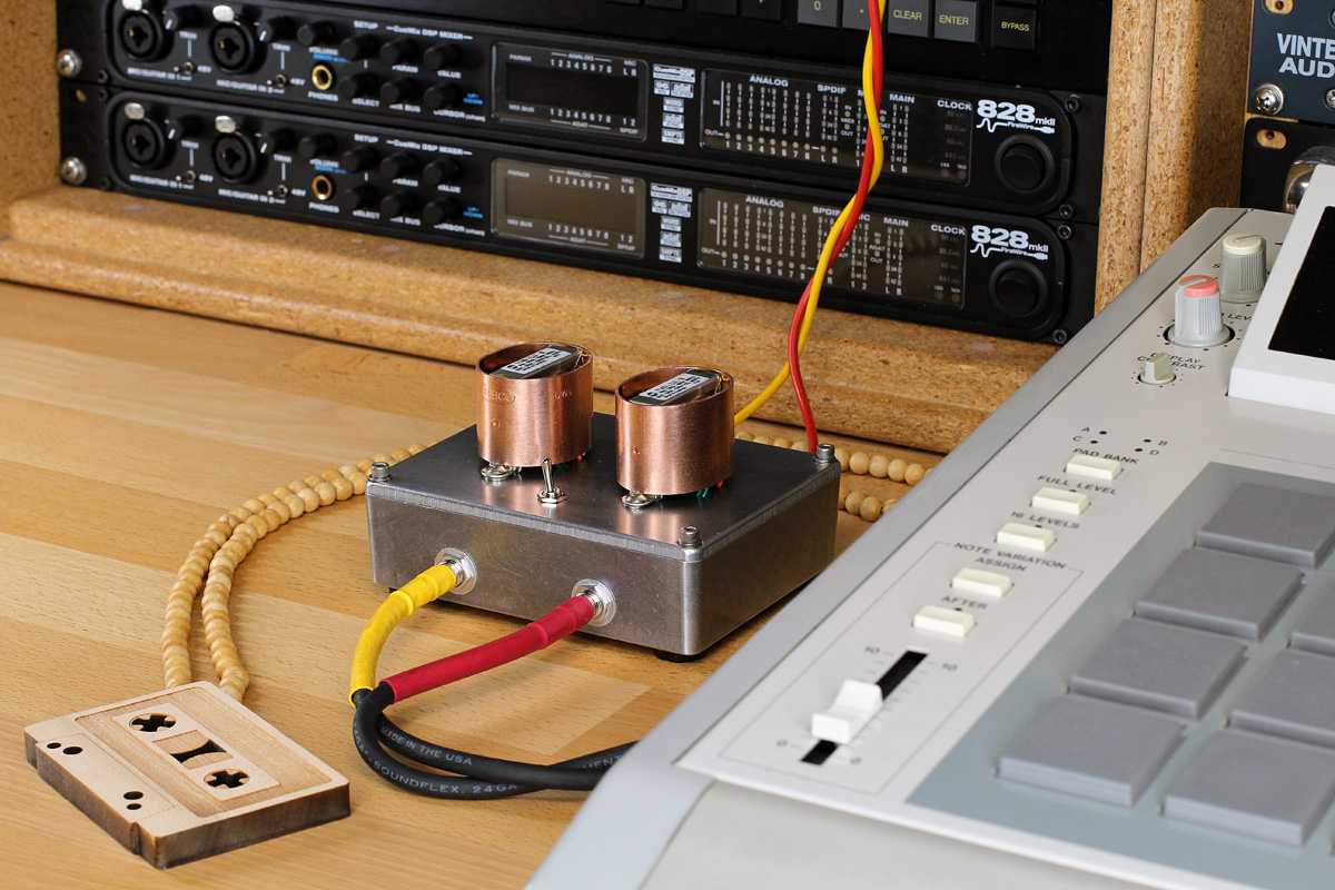 Stereo Hi-Fi audio transformer box with copper shield on studio table.