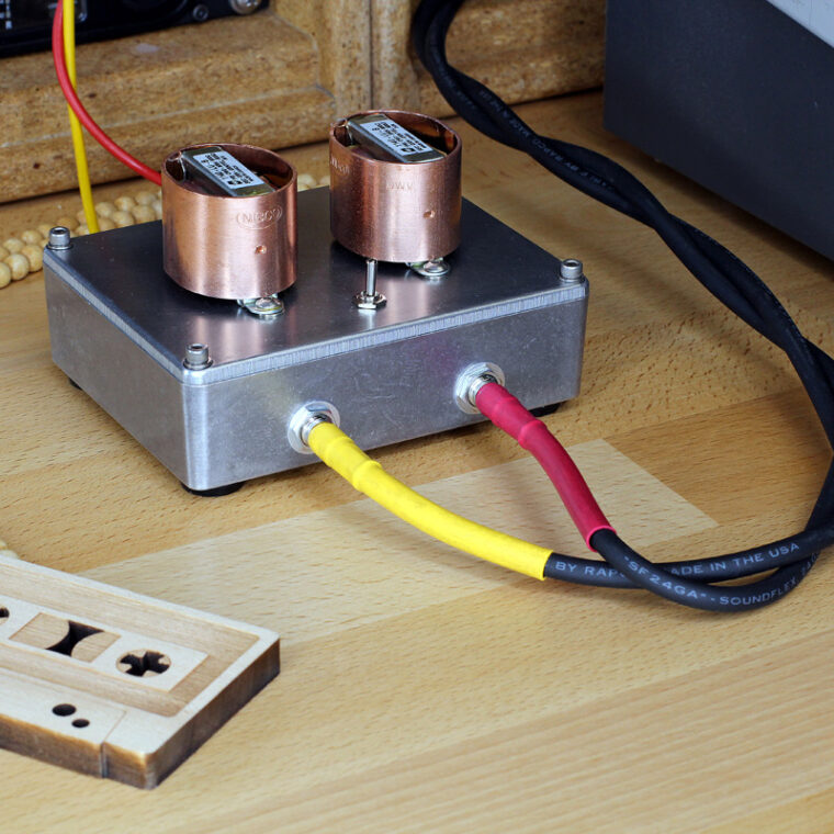 Stereo Hi-Fi audio transformer box with copper shield on studio table.